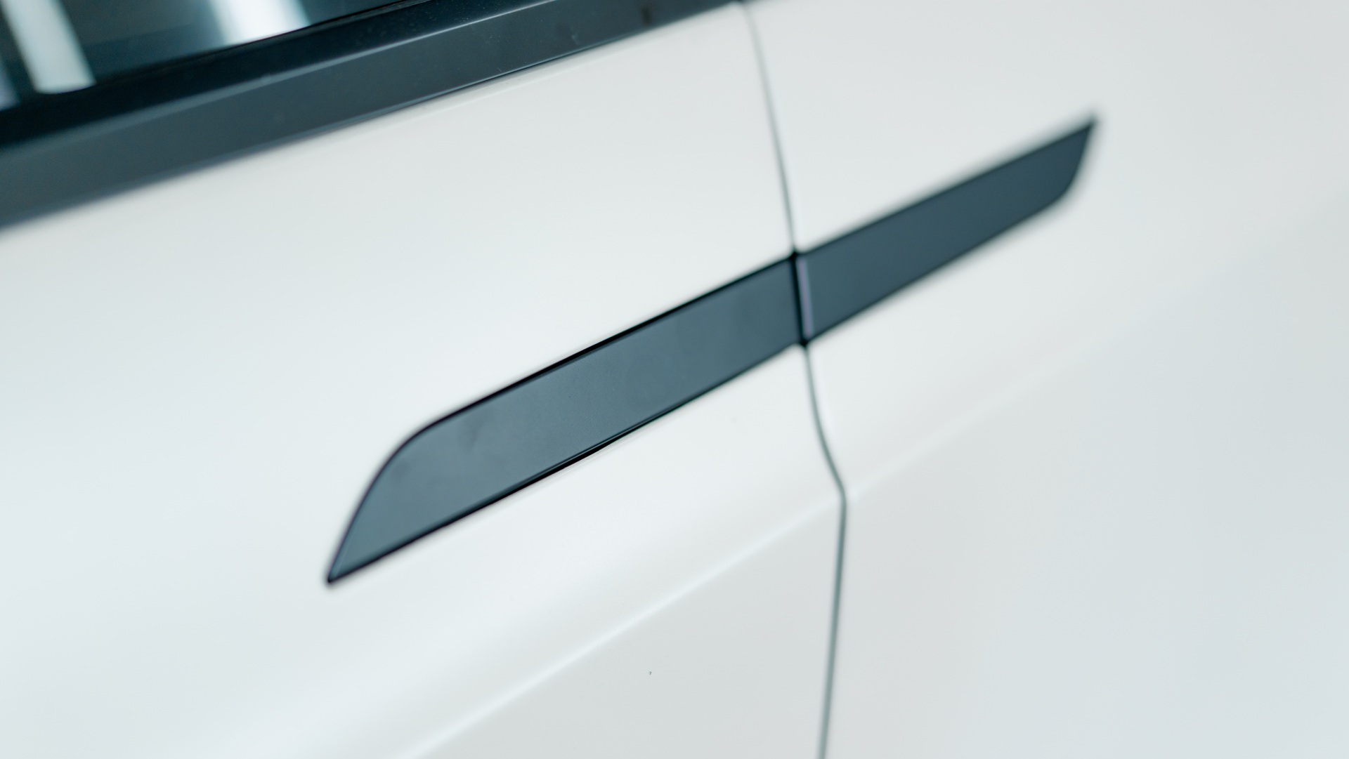 envato-modern-white-car-door-handle-detail-close-up-2026-03-17-21-45-28-utc